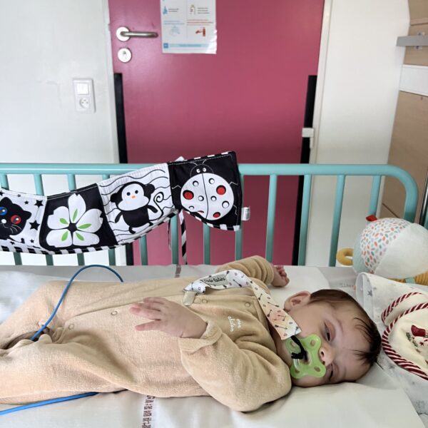 Gabriela sleeping in hospital crib.