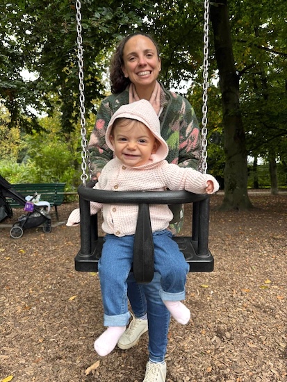 Gabriela on swing at park.